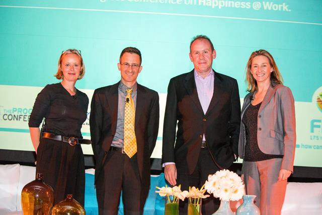 Nicola Tyler with fellow speakers at a conference on happiness at work